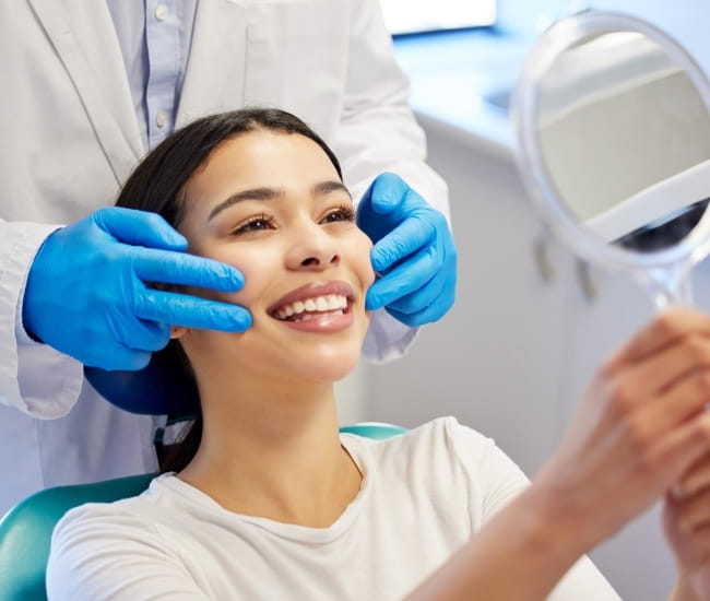 Patient smiling confidently after a dental checkup at Diamond Edge Dental Clinic